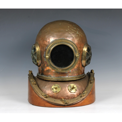 59 - A Chinese or similar 12-bolt diving helmet, copper and brass, of characteristic form with beaten bon... 