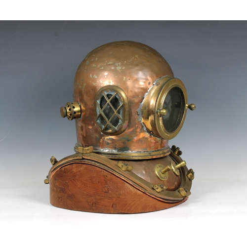 59 - A Chinese or similar 12-bolt diving helmet, copper and brass, of characteristic form with beaten bon... 