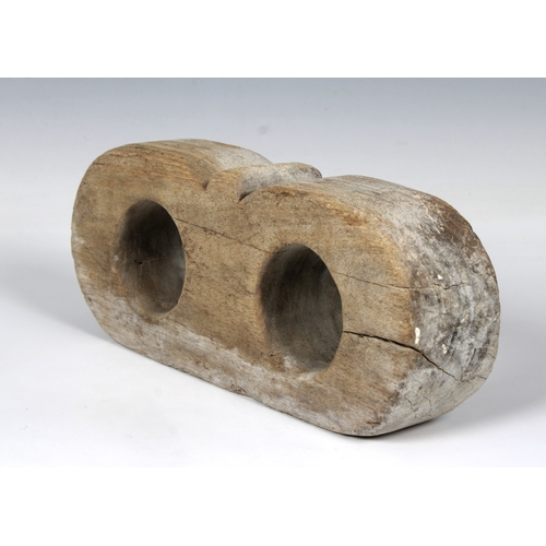 64 - An antique ships wooden pulley tensioner block, probably early 19th century or before, 26cm. long.