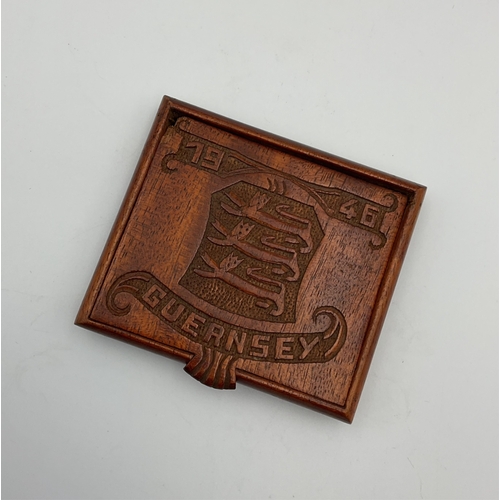 106 - Guernsey Occupation interest - A carved wooden cigarette case, dated 1946, probably carved in Guerns... 