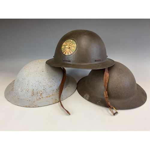 154 - A British Brodie Army Steel WWI London Brigade Helmet, with hand painted insignia, interior fittings... 