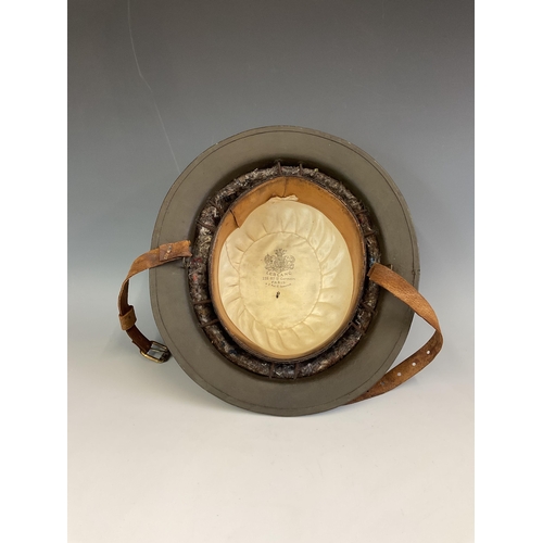 154 - A British Brodie Army Steel WWI London Brigade Helmet, with hand painted insignia, interior fittings... 