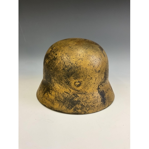 159 - A German World War Two (WWII) D.A.K desert camouflage Afrikakorps stahlhelm helmet, stamped Q64 & T7... 