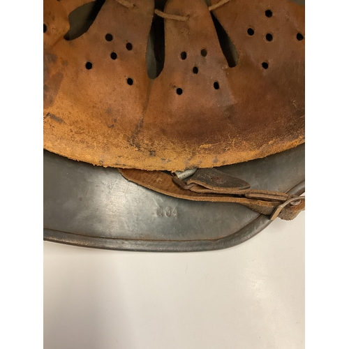 159 - A German World War Two (WWII) D.A.K desert camouflage Afrikakorps stahlhelm helmet, stamped Q64 & T7... 