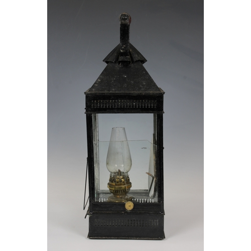 28 - A James Hicks and Sons Limited wooden cased metal storm lantern, possibly campaign, painted in black... 