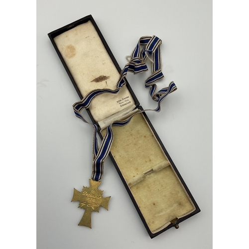 97 - A boxed German 'Der Deutschen Mutter' (German mothers cross) medal, cobalt blue enamel cross with wh... 