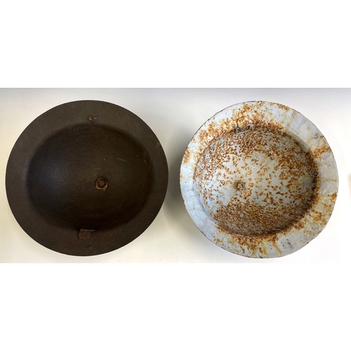 154 - A British Brodie Army Steel WWI London Brigade Helmet, with hand painted insignia, interior fittings... 