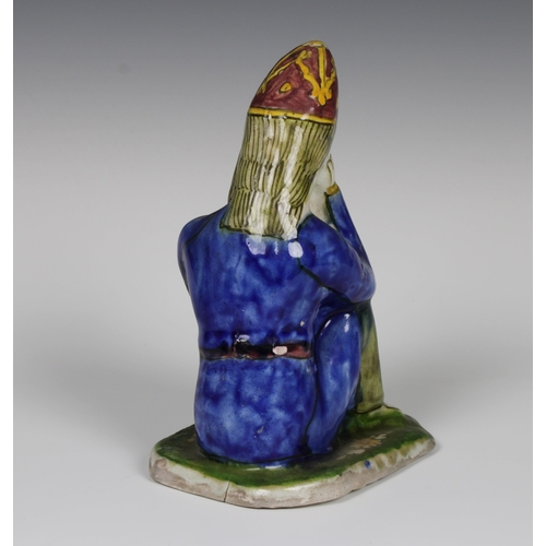 104 - A Persian pottery statue of a Hakhamaneshi man, early 19th century, 23cm. high.Provenance: from The ... 
