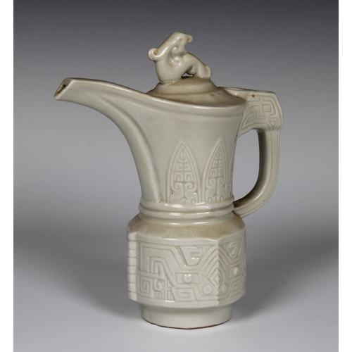 109 - A 20th century Frankoma Mayan Aztec style white glazed pottery pitcher, 18.5cm. high.Provenance: fro... 