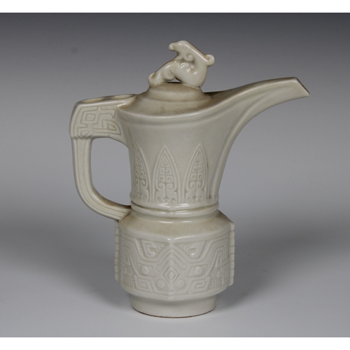 109 - A 20th century Frankoma Mayan Aztec style white glazed pottery pitcher, 18.5cm. high.Provenance: fro... 