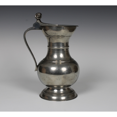 111 - A Swiss pewter lidded flagon by Louis Moriggi, Vevey, with acorn finials to handle, 1930's, marked t... 
