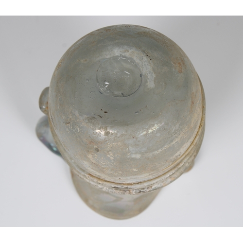 112 - An ancient Roman glass jug, possibly 3rd - 4th century CE, featuring a single loop handle and traile... 
