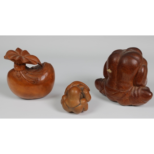120 - A Japanese carved wooden figure of Hotei, the Laughing Buddha, 11cm. high, together with an Asian ca... 