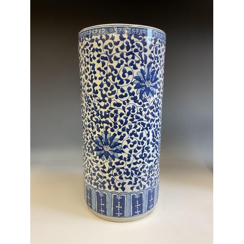 363 - Chinese blue and white stick stand, the heavily potted body decorated with foliate design and flower... 