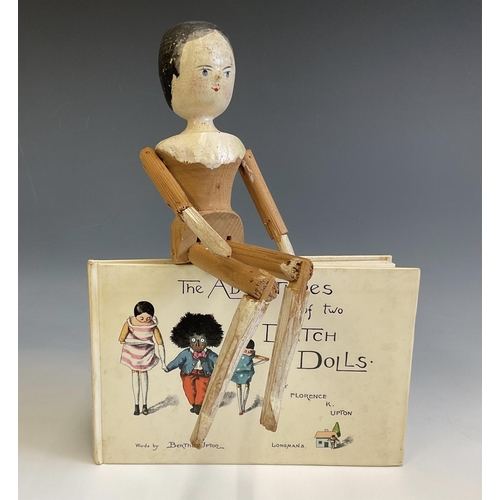435 - Victorian Wood Peg Doll with naive painted face, moving limbs, 30cm high, together with book - The A... 