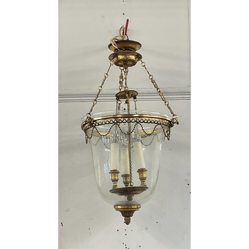 458 - A metal glass dome ceiling light with three candles and  acorn finial, approx drop 70cm.