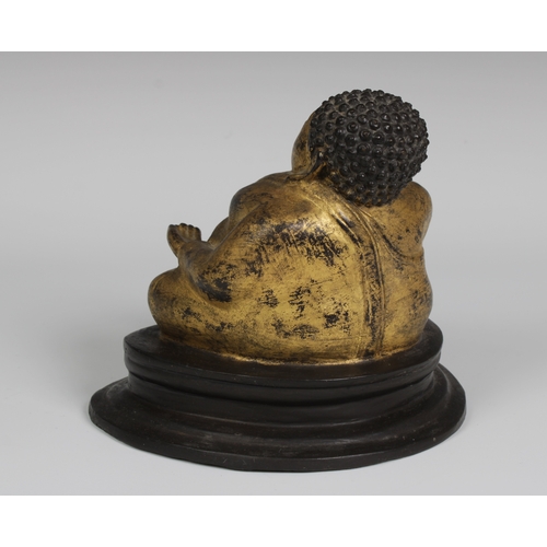 86 - A late 19th century Thai gilt bronze figure of Phra Sangkachai, Rattanakosin Kingdom, with integral ... 