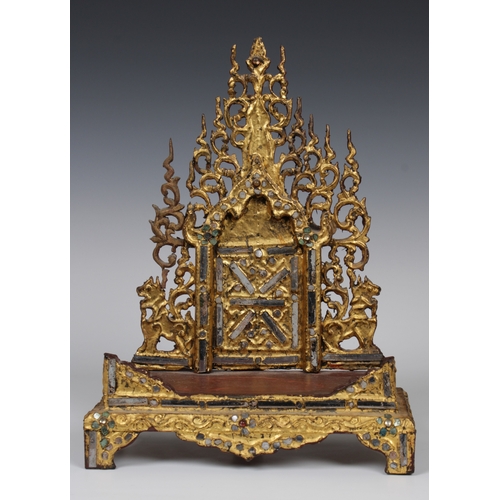 87 - A Burmese Buddha shrine or throne, gilt wood inlaid with coloured glass, 23 x 12.5cm. x 31cm. high.P... 