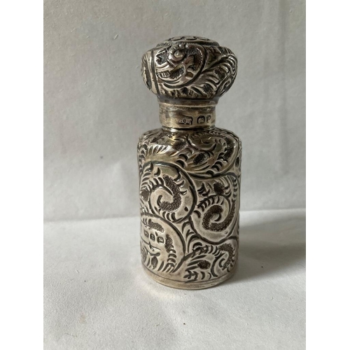 28 - A late Victorian silver scent bottle, Birmingham, 1899, maker's mark JHW, embossed with fern fronds ... 