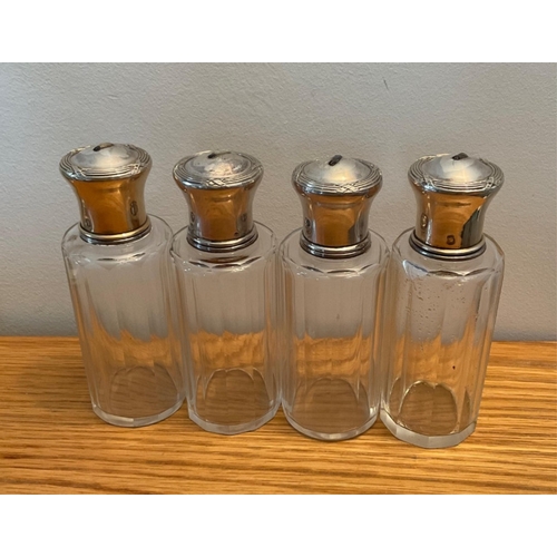 38 - A set of four French silver Shibayama insect mounted glass perfume jars, First quarter twentieth cen... 