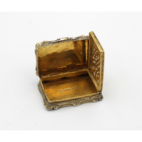 49 - A Victorian silver gilt shaped rectangular vinaigrette, Nathaniel Mills, Birmingham,1845, scroll & f... 