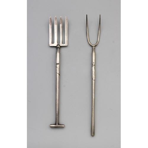 5 - Two novelty silver 800 grade serving forks, Fashioned as a garden fork and pitch fork, both with ins... 