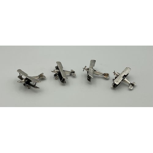 14 - Four Italian silver models of two types of WWI biplane, two marked beneath fuselage and two marked b... 