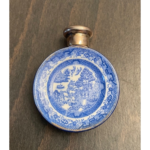 26 - A novelty Victorian silver mounted porcelain scent bottle, Sampson Mordan & Co, London, 1885, of cir... 