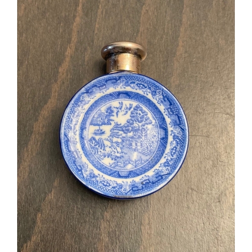 26 - A novelty Victorian silver mounted porcelain scent bottle, Sampson Mordan & Co, London, 1885, of cir... 