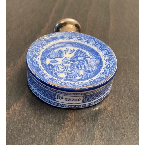 26 - A novelty Victorian silver mounted porcelain scent bottle, Sampson Mordan & Co, London, 1885, of cir... 