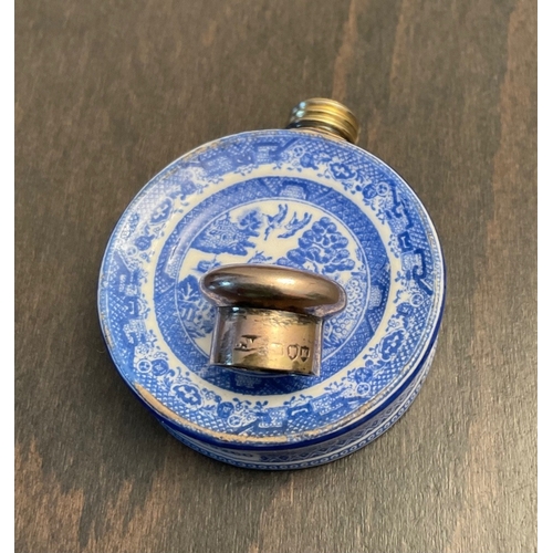 26 - A novelty Victorian silver mounted porcelain scent bottle, Sampson Mordan & Co, London, 1885, of cir... 