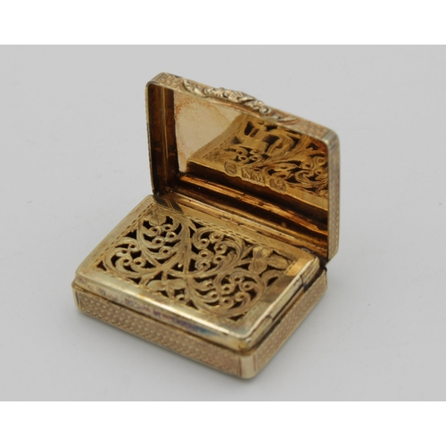 48 - A William IV silver-gilt rounded rectangular vinaigrette, Nathaniel Mills, Birmingham, 1830, engine-... 