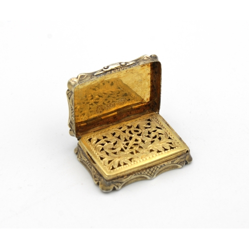 49 - A Victorian silver gilt shaped rectangular vinaigrette, Nathaniel Mills, Birmingham,1845, scroll & f... 