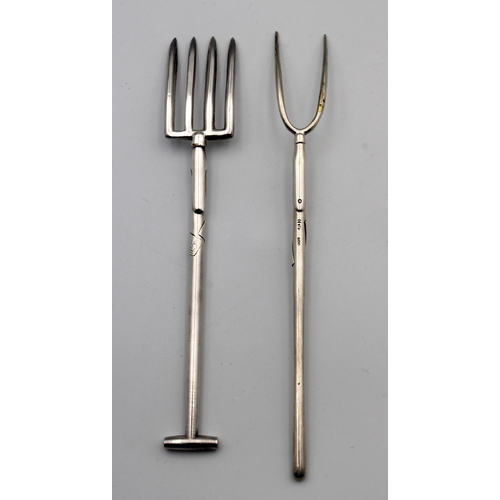 5 - Two novelty silver 800 grade serving forks, Fashioned as a garden fork and pitch fork, both with ins... 