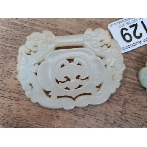 129 - Pair of Carved Jade Pendants on Wooden Stands