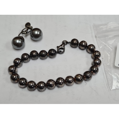 32 - Sterling Silver Ball Bracelet and a Matching Pair of Silver Earrings