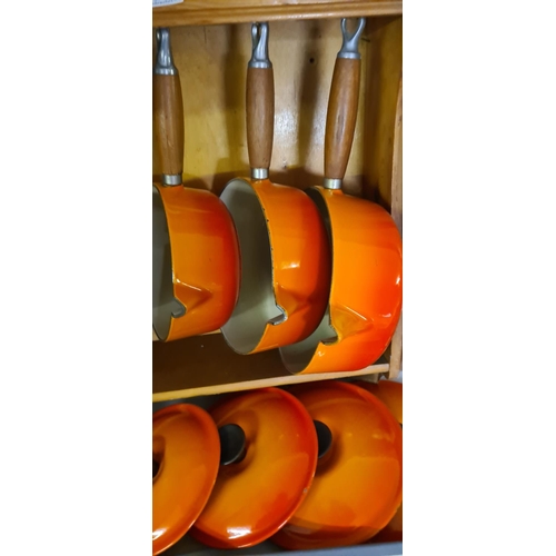 163 - Set of 5 Vintage Cast Iron Orange Le Creuset Pans on Le Creuset Wooden Rack