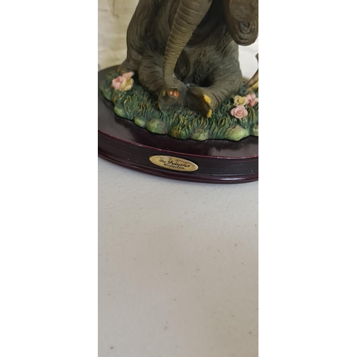 1020 - Elephant Figurine on a Wooden Plinth