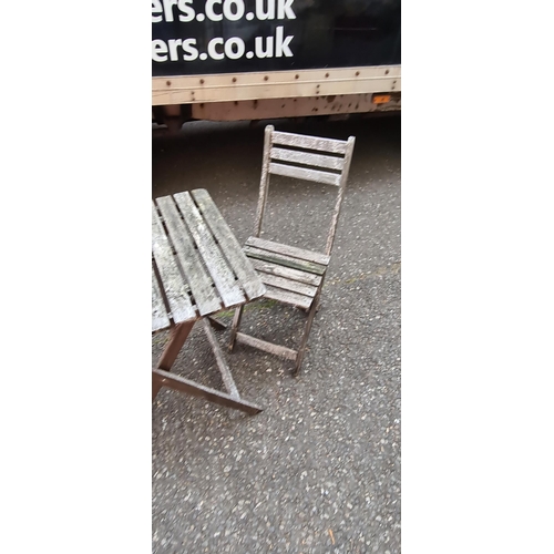 75 - Weathered teak garden table and 2 chairs