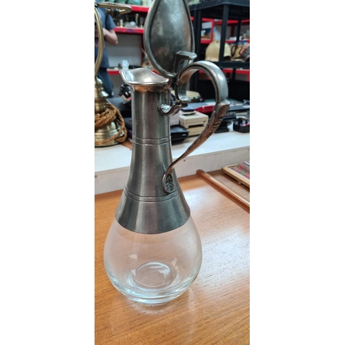 69 - Pewter Claret Jug