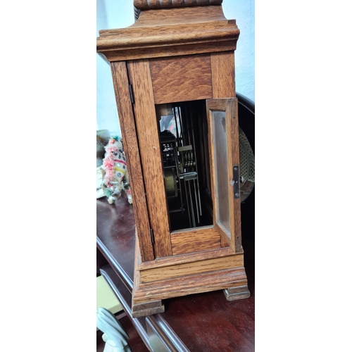 273 - An early 20th Century Gustav Becker Oak Cased Chiming Mantle Clock