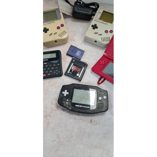 306 - 2 Vintage Gameboys, a Nintendo DS, Gameboy Advance etc