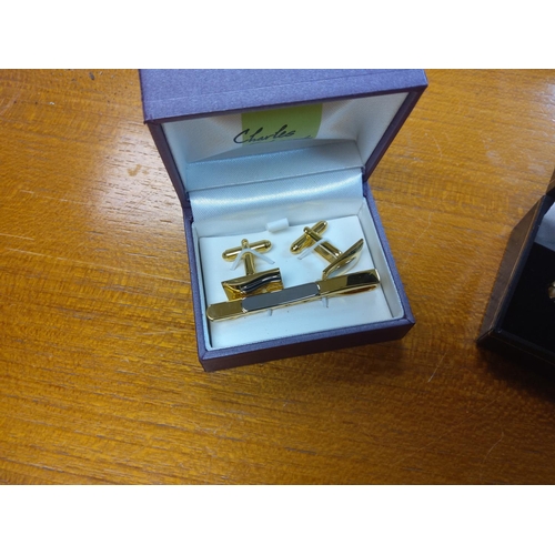 243 - 2 New and Boxed Cufflinks/ Tie Clip Sets