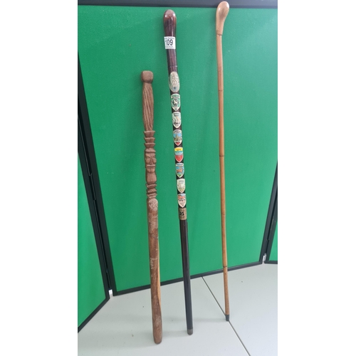 109 - 3 Vintage Walking Sticks one with Various Crests