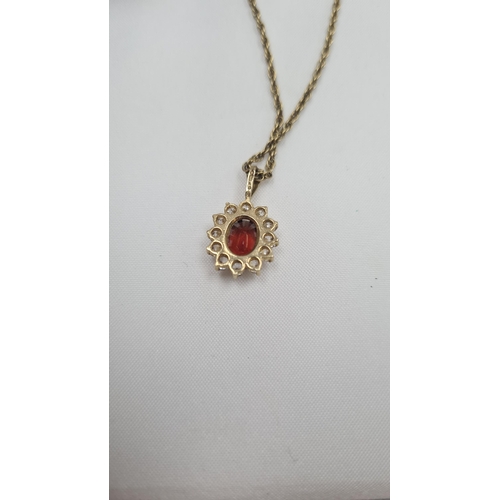 117 - 9ct Gold Pendant on a Yellow Metal Chain