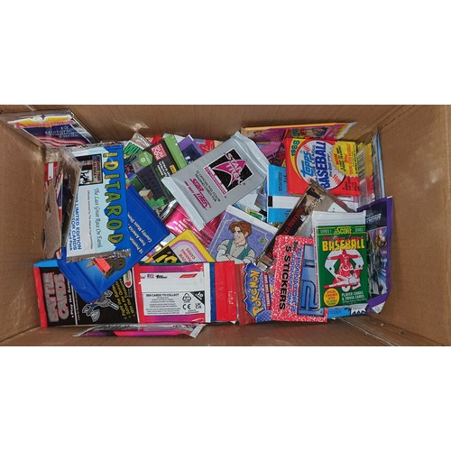 9 - Box containing a selection of unopened packs of trading cards and stickers including Pokemon, Baseba... 
