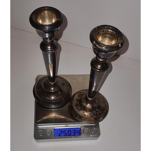 17 - A Pair of hallmarked Silver candle stick holders - Gross weight: 250g