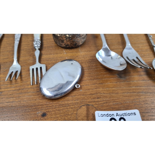 93 - Good Collection of Silver Spoons plus a Napkin Ring and a Locket 247g