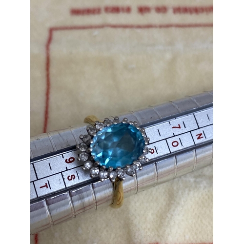 7 - 18ct Gold Aquamarine/Diamond Ring. Approx 2 carat with 20 Surrounding Diamonds. 5.6 Grams Size R