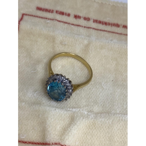 7 - 18ct Gold Aquamarine/Diamond Ring. Approx 2 carat with 20 Surrounding Diamonds. 5.6 Grams Size R